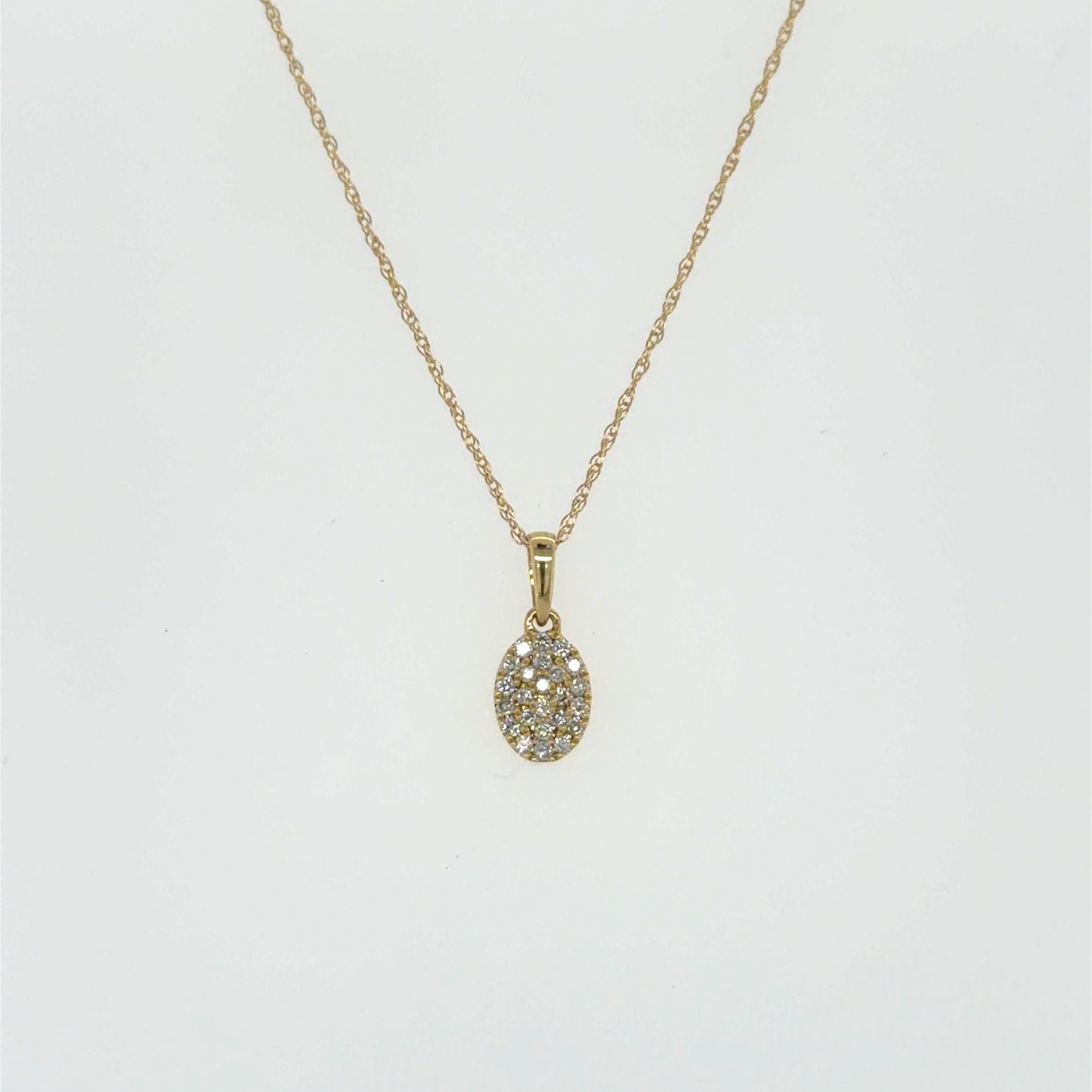 0.13 CTW Oval Diamond Pendant in 14K Yellow Gold