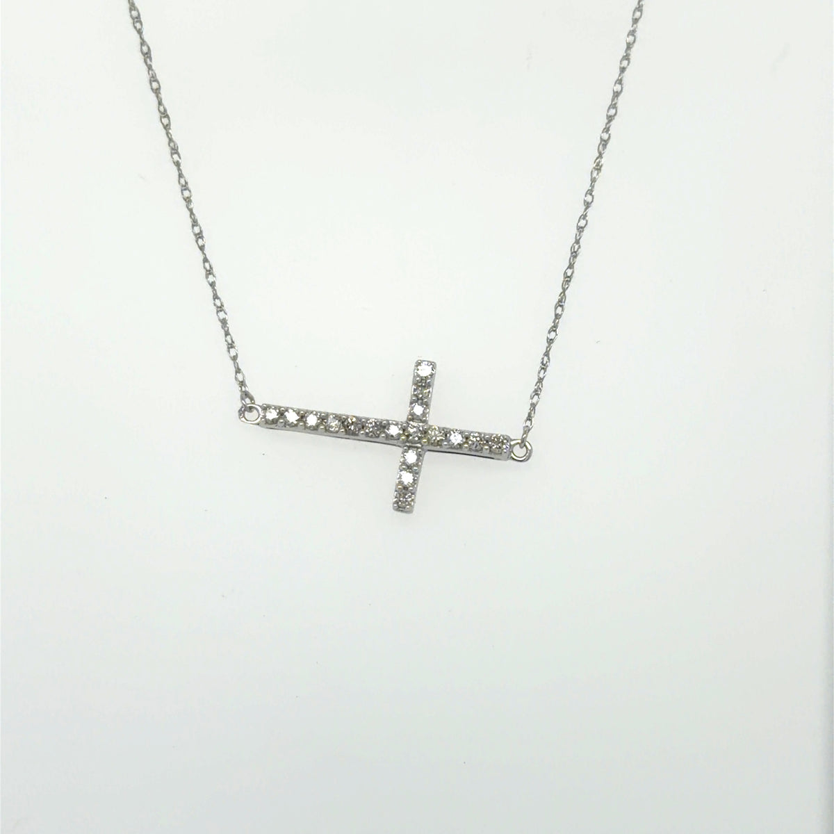 0.2 CTW Sideways Diamond Cross Pendant in 10K White Gold