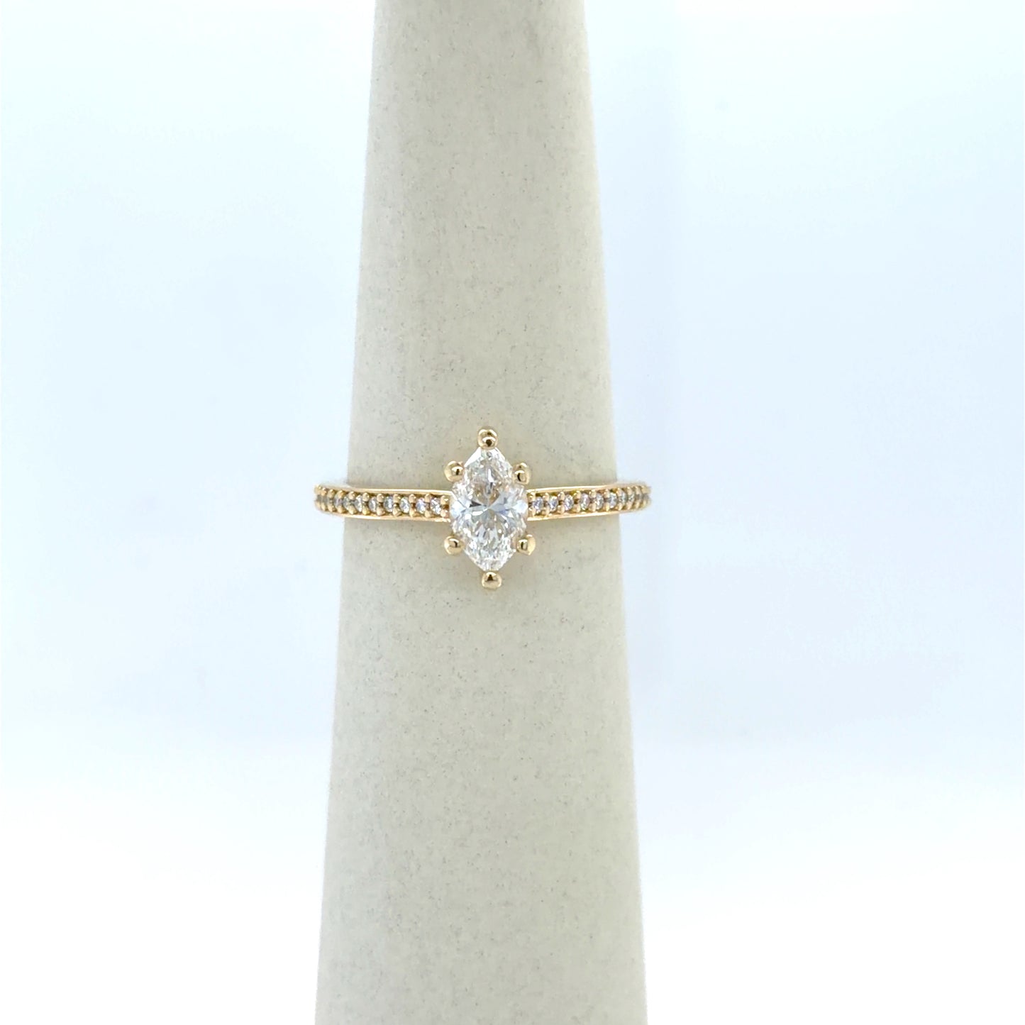 0.7 CT Marquise Diamond Side-Stone Engagement Ring in 14K Yellow Gold