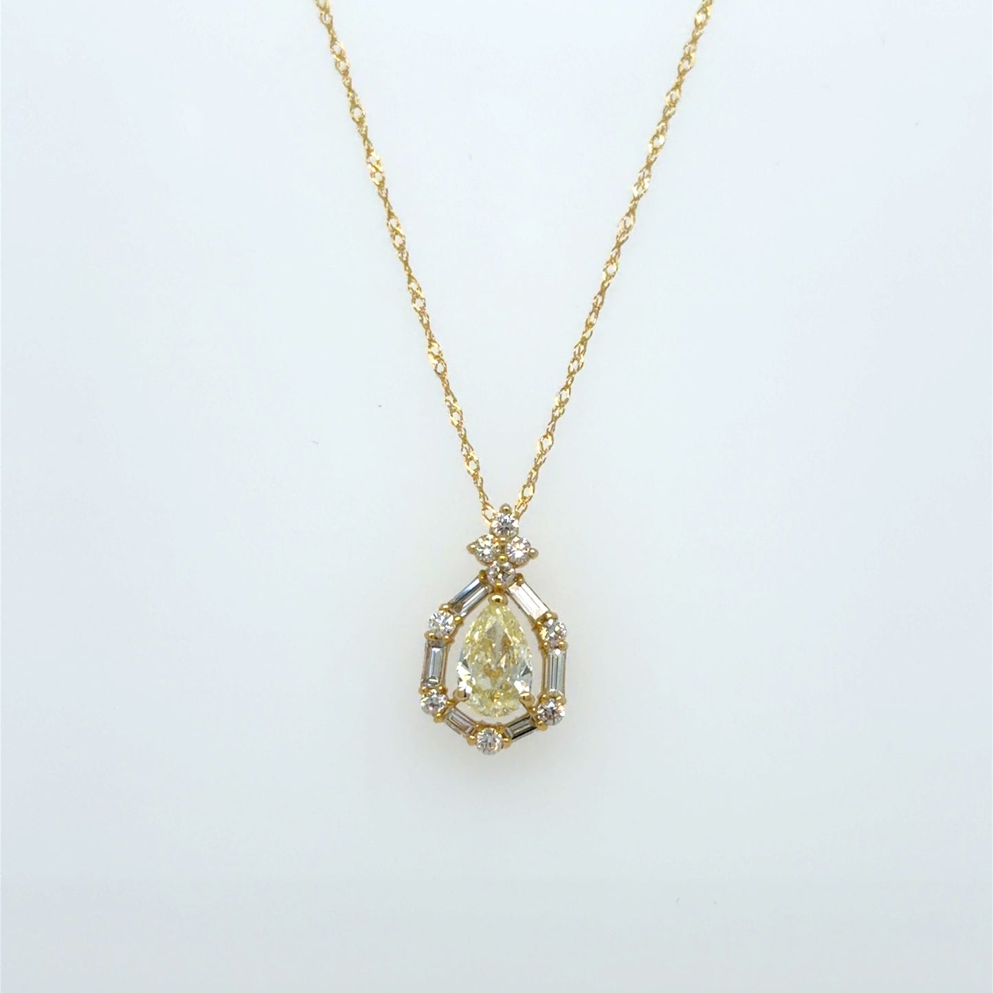 0.69 CT Natural Pear Diamond & Baguette Halo Pendant in 18K Yellow Gold