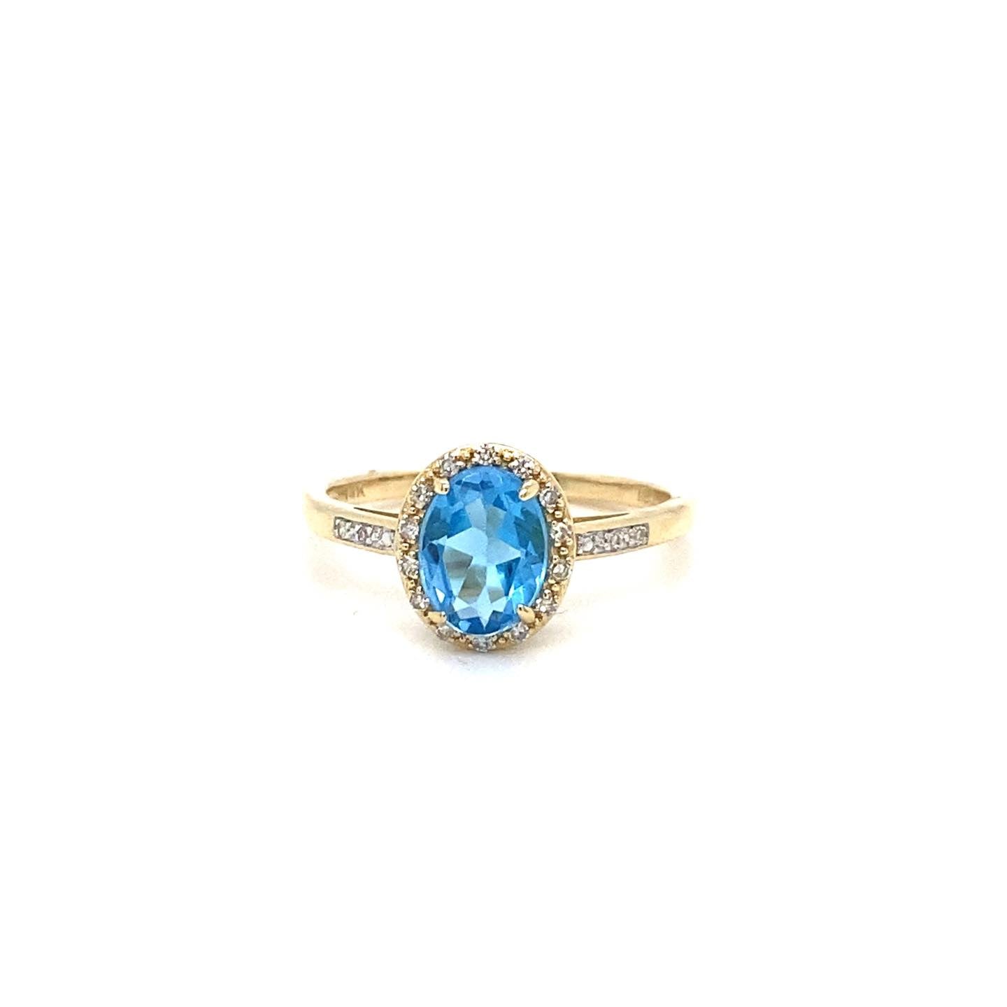 .08ctw Diamond and Blue Topaz 14kt Yellow Gold Ring