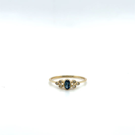 .28ctw London Blue Topaz and .07ctw Diamond Yellow Gold Ring